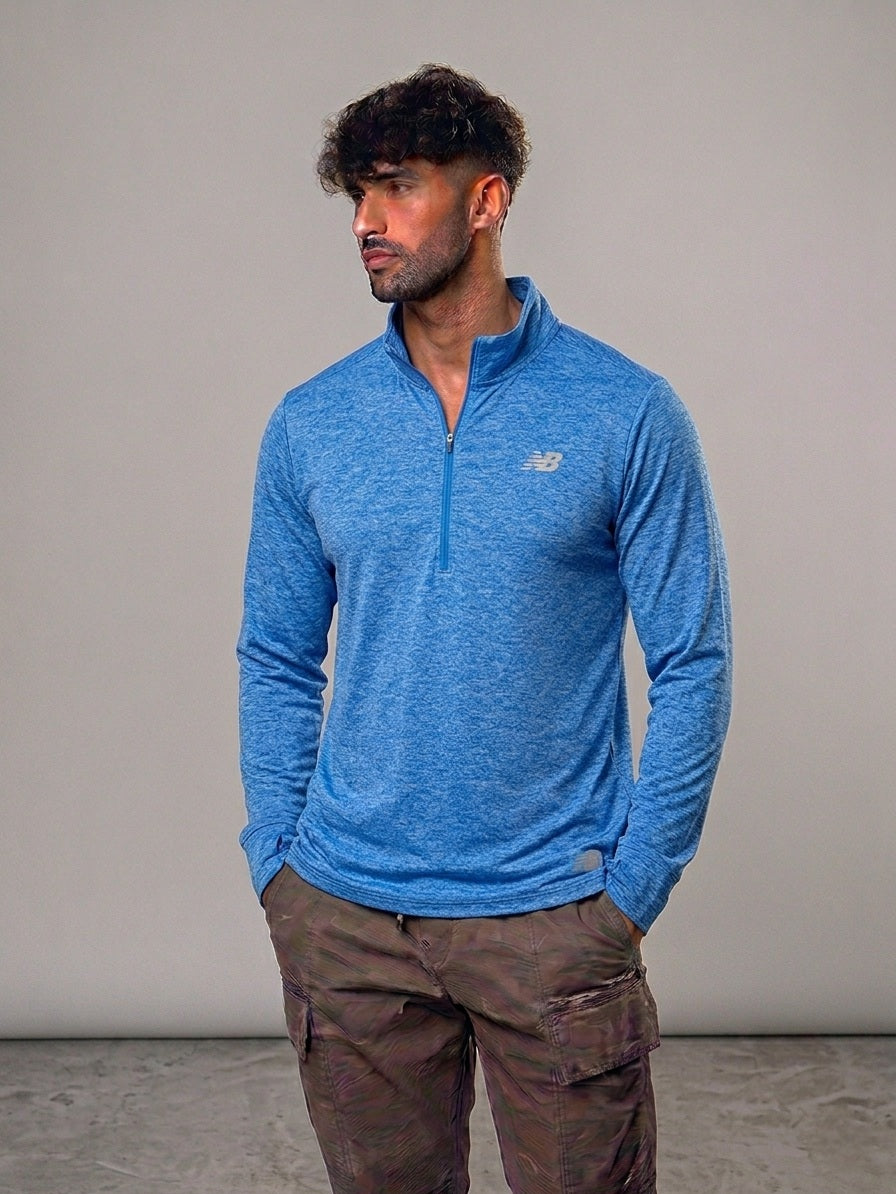 Polera New Balance Performance – Half Zip Azul Jaspeado🇺🇸